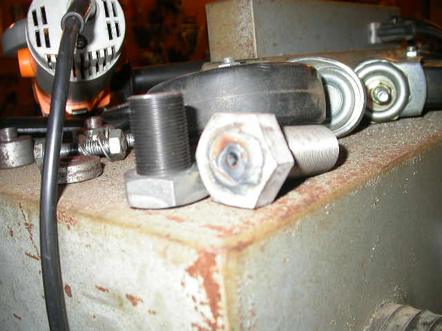 Since I had already messed up a couple TRE's, I went ahead and cut off part of their threaded sections and made a couple 7/8-18 bolts, one left hand thread and one right hand thread, to stick into the other tube adapters while I'm welding them.