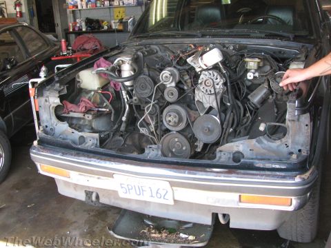 1987 Suzuki Samurai - Front view of a 1987 Chevrolet S-10 pickup truck with its engine exposed for service.