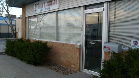 1995 Ford C-350 (Centurion Conversions) - A storefront with a sign reading 'GAY & JEWELRY' and a phone number is visible, along with a mailbox.