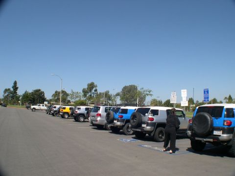 2007 Toyota FJ Cruiser - Several Toyota FJ Cruisers are parked in a lot under a clear blue sky.