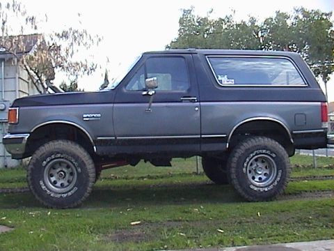 1990 Ford Bronco - This 1990 Ford Bronco is presented in a side profile, its lifted suspension and substantial tires.