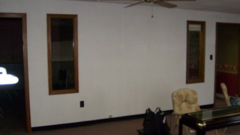 1995 Ford C-350 (Centurion Conversions) - Room interior with decorative mirrors and furniture, no vehicles visible.