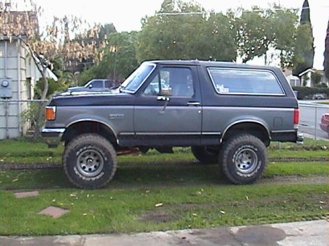 1990 Ford Bronco - This lifted 1990 Ford Bronco features large off-road tires, giving it a stance.