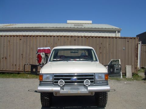 1991 Ford Bronco - 1991 Ford Bronco front view, showing its grille, bumper, and lights.