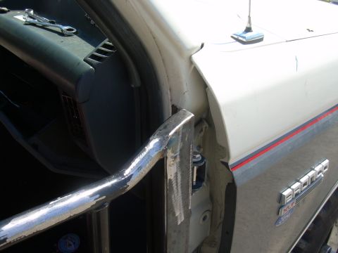 1991 Ford Bronco - Close-up of the door frame and "BRONCO" badging on a 1991 Ford Bronco.