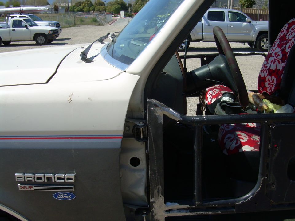 1991 Ford Bronco XLT door and interior with Hawaiian seat covers