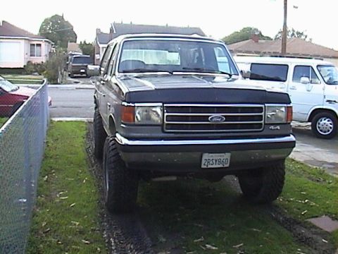 1990 Ford Bronco - This lifted 1990 Ford Bronco features oversized tires and a prominent front grille.