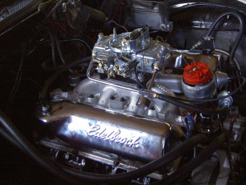1972 Ford Ranchero - Close-up of a V8 engine with a chrome Edelbrock valve cover and Holley carburetor.