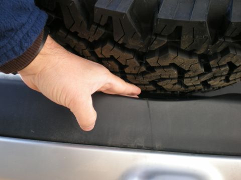 2007 Toyota Land Cruiser - Clearance under Tire. Room to slip my hand under. I could go maybe 3/4" more.