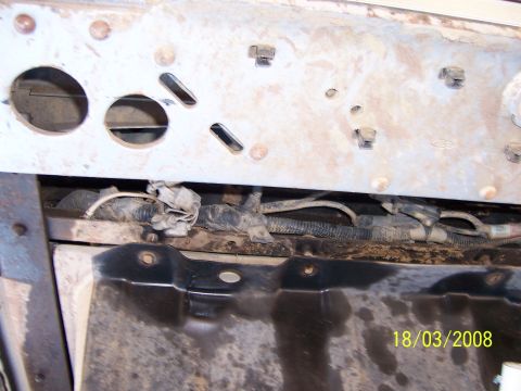 1991 Ford Bronco - Close-up view of the wiring harness in the engine bay, showing electrical connections and protective wrapping.