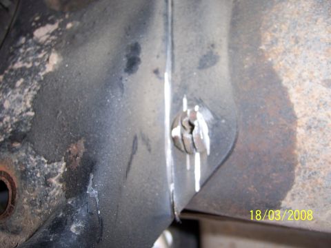 1991 Ford Bronco - Detail of a rusty metal bracket and bolt, captured on 18/03/2008.