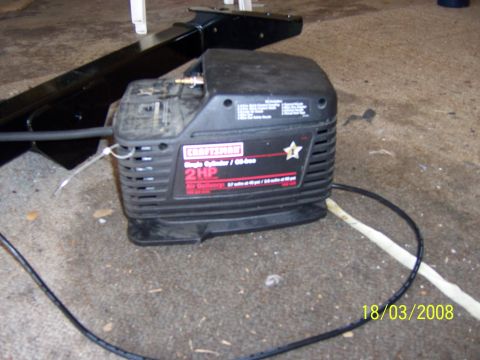 1991 Ford Bronco - Craftsman 2 HP air compressor with visible model information and date stamp.