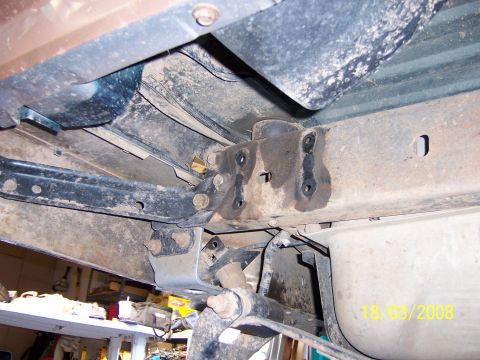 1991 Ford Bronco - Close-up of the undercarriage, showing suspension and frame details with a date stamp.