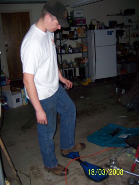 1991 Ford Bronco - A person stands in a cluttered garage, with a date stamp visible on the floor.