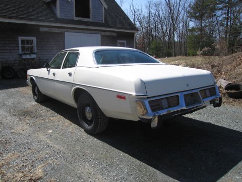 1991 Ford Crown Victoria LTD - A white 1977 sedan is parked on a gravel driveway in front of a barn.