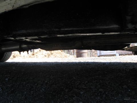 1991 Ford Crown Victoria LTD - Underside view of a vehicle, showing the exhaust pipe and frame.