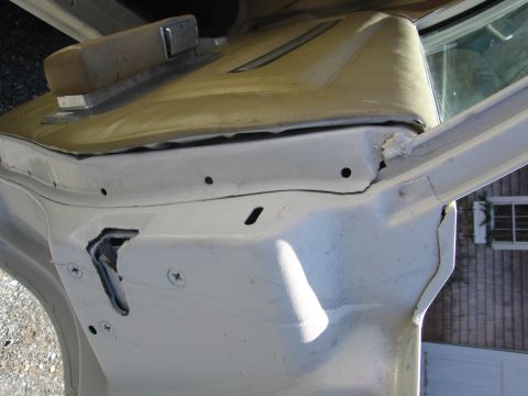 1991 Ford LTD Crown Victoria - Interior door jamb detail of a vehicle, showing painted metal and upholstery.