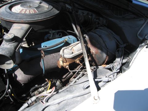 1991 Ford LTD Crown Victoria - The engine bay shows a "440" air cleaner and a rusty brake master cylinder, not a 1991 Ford Crown Victoria LTD.