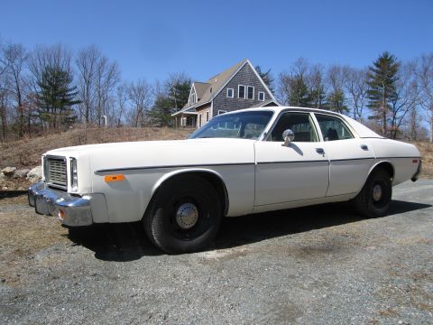 1991 Ford LTD Crown Victoria - This 1977 Dodge Monaco sedan is shown from the front 3/4 angle on a sunny day.