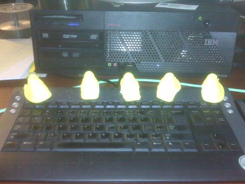 1996 Ford Bronco - Yellow marshmallow candies are lined up on a keyboard in front of a computer tower.