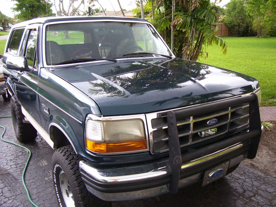Dark green 1993 Ford Bronco with brush guard and chrome bumper