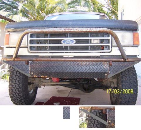 1991 Ford Bronco - Front view of a 1991 Ford Bronco a custom diamond plate bumper and brush guard over the grille.