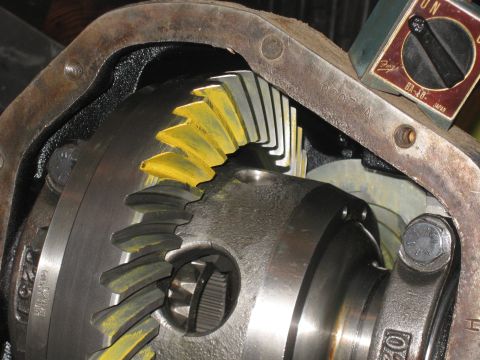1990 Ford F-250 - Close-up of differential gears, likely for a truck, with yellow paint markings and a small gauge attached.