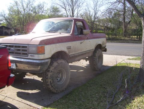 1988 Ford Bronco - This lifted Ford Bronco has a two-tone paint scheme and appears to be from the late 1980s.
