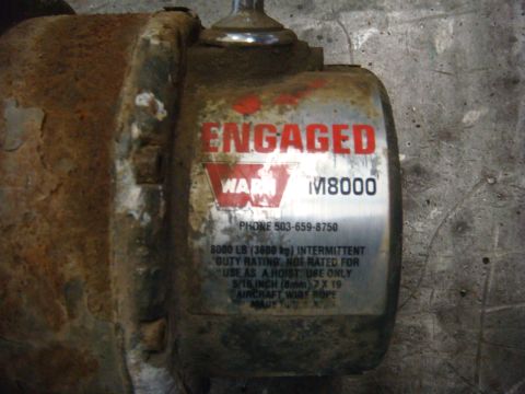 1996 Ford Bronco - Warn M8000 winch label shows phone number and load rating.