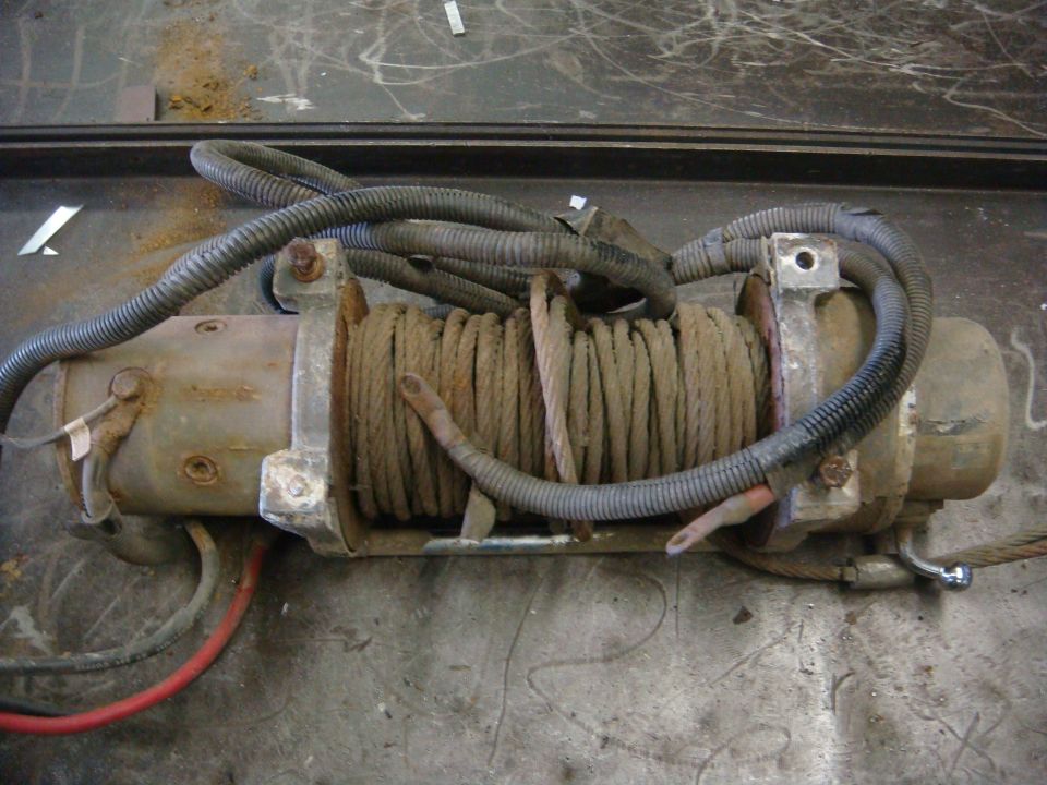 Winch with coiled cable and wiring