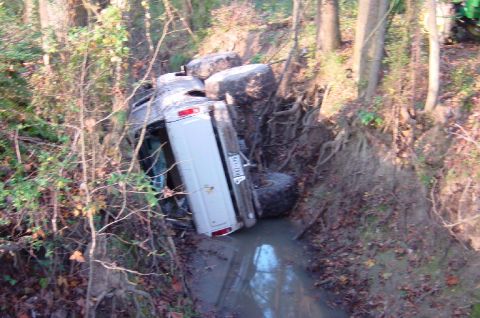 1979 Ford Bronco - This white SUV ended up on its side in a ditch, with only its rear and side clearly visible.