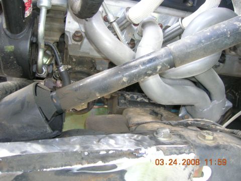 1996 Ford Bronco - Engine exhaust manifold and pipes are visible in this close-up view.