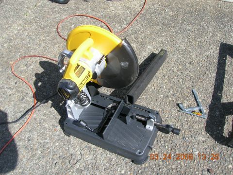 1996 Ford Bronco - DeWalt chop saw and steel stock on a gravel surface, dated 03/24/2008.
