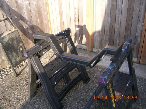 1996 Ford Bronco - A black crossmember is supported by sawhorses outdoors, with a wooden fence in the background. A date stamp reads 03.24.2008.