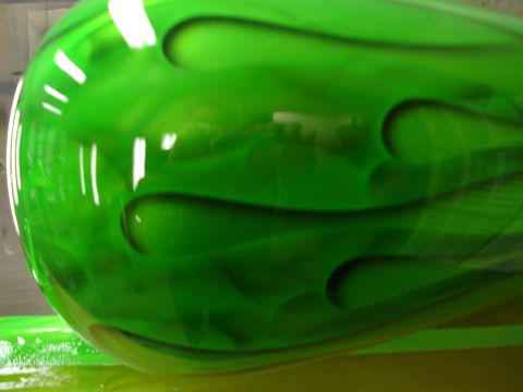 2006 Harley-Davidson FLHX - Motorcycle fuel tank with custom green flame paint job. Supermotors.net logo in corner.