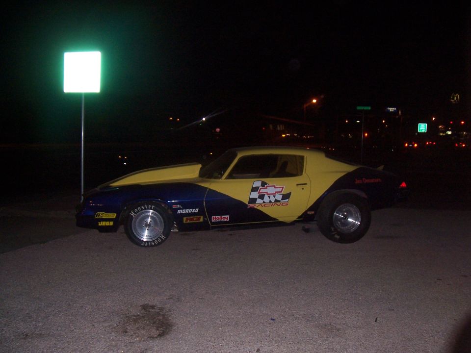 Blue and yellow 1979 Chevrolet Camaro drag car with racing decals