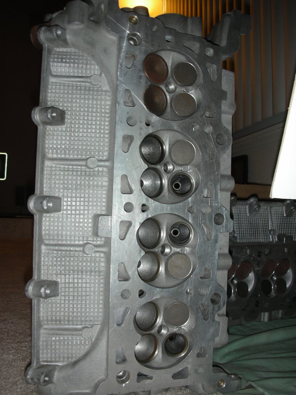 Combustion-chamber face of an aluminum cylinder head with four valves per cylinder