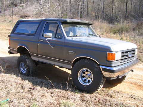 1989 Ford Bronco - This 1989 Ford Bronco is shown off-road with large tires and a lifted suspension.