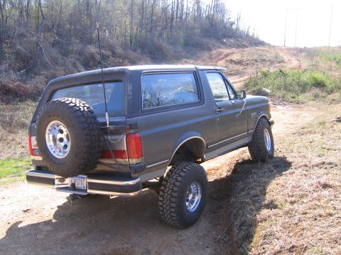 1989 Ford Bronco - This 1989 Ford Bronco is shown off-roading on a dirt path.