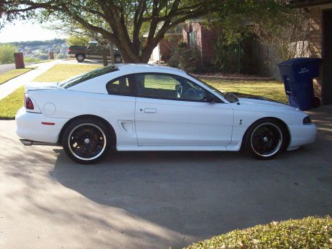 1997 Ford Mustang - Passenger side, look at that rake!