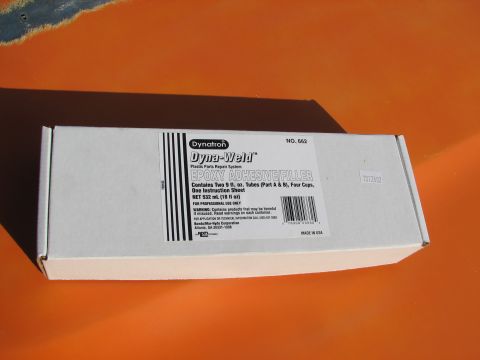 1979 Ford Bronco - A box of Dynatron Dyna-Weld Epoxy Adhesive Filler is shown on an orange surface.