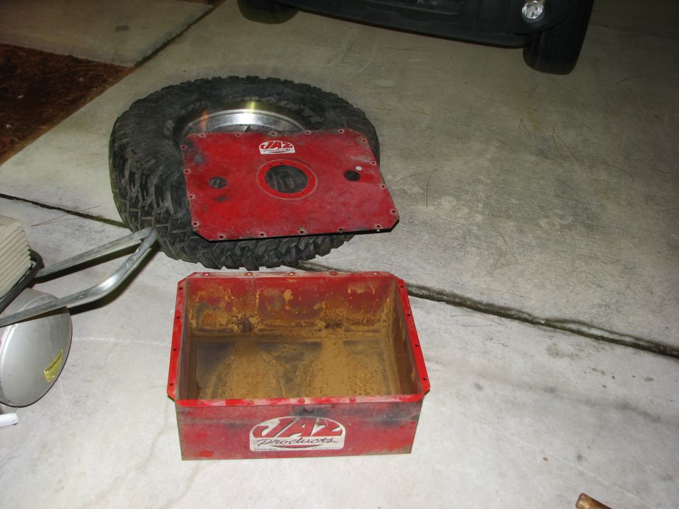 Red JAZ Products fuel cell and a spare tire with a red metal plate on top