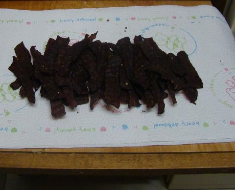 1989 Ford Bronco - A pile of beef jerky rests on a paper towel decorated with bears and the words "beary delicious".