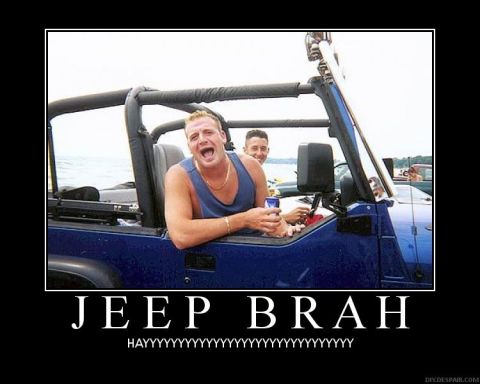 1984 Ford Bronco - A man in a blue Jeep Wrangler appears to be shouting while a passenger smiles behind him.