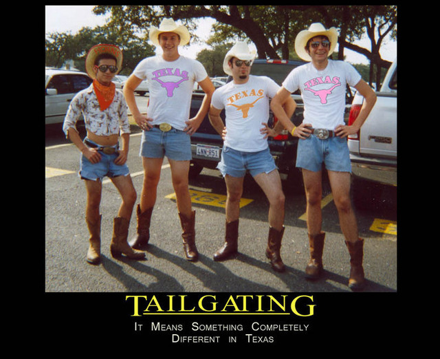 Four men in cowboy hats, denim shorts, and boots stand in a parking lot