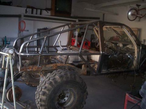 1982 Toyota 4Runner - This vehicle is undergoing a custom build, a prominent roll cage and exposed chassis.