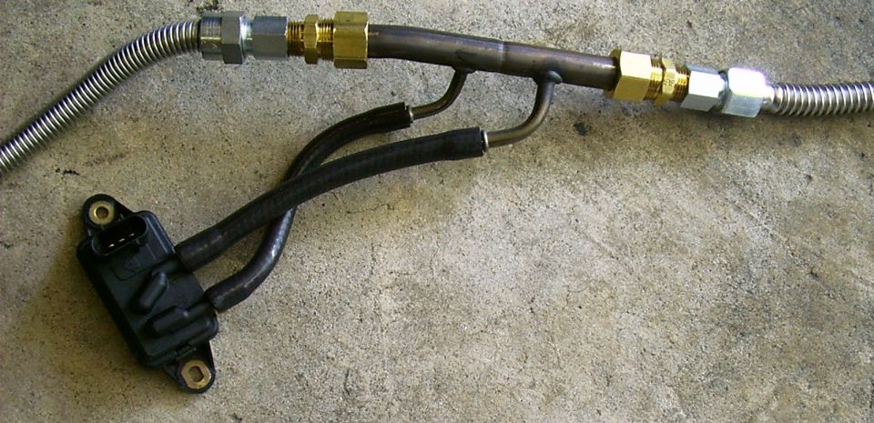 Exhaust pressure sensor connected to metal tubing and flexible hose