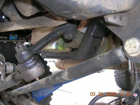 1996 Ford Bronco - Close-up of the steering and suspension components, showing a modified crossmember.