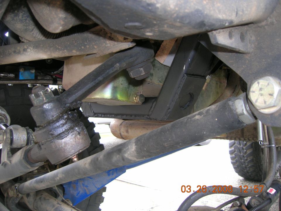 Underbody view of steering linkage and suspension crossmember