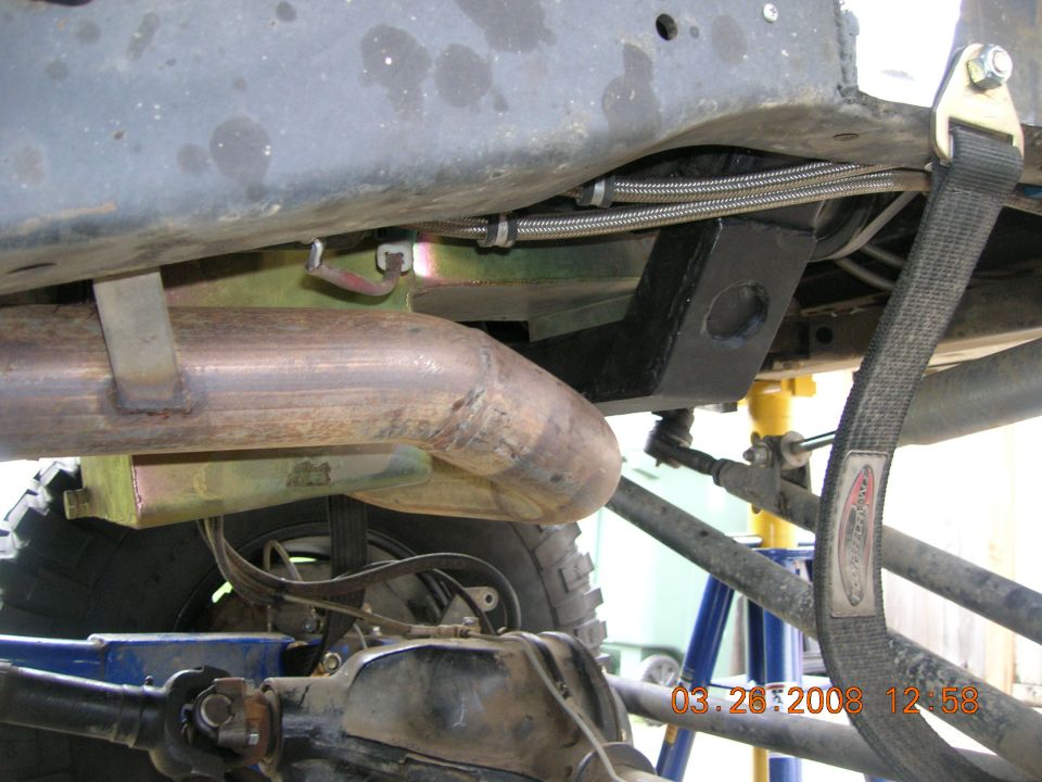 Underbody view showing exhaust pipe, suspension parts, and frame modifications. Date stamp reads 03.28.2008
